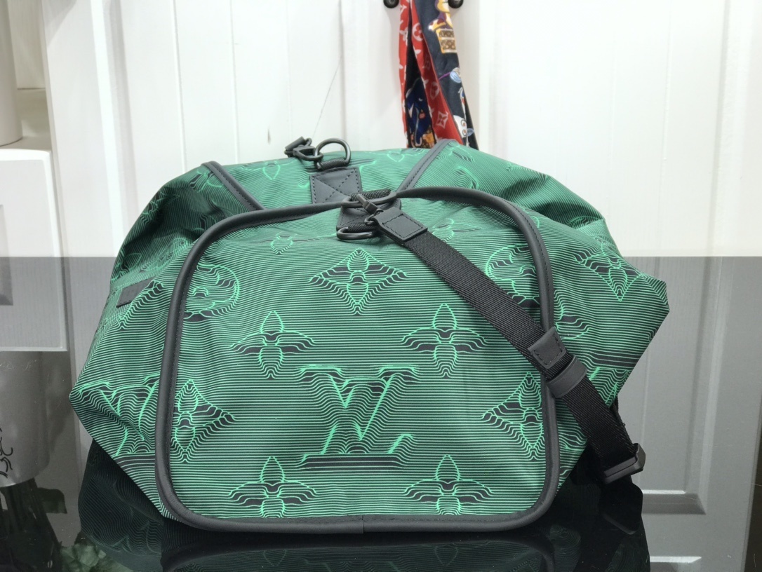 LV 2054 REVERSIBLE KEEPALL BANDOULIERE 50 M45602