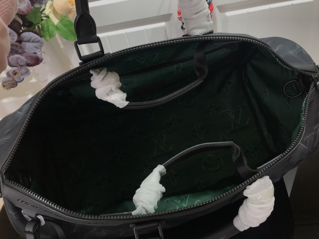 LV 2054 REVERSIBLE KEEPALL BANDOULIERE 50 M45602