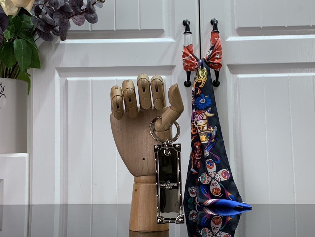 LV KEY HOLDER AND BAG CHARM M68303