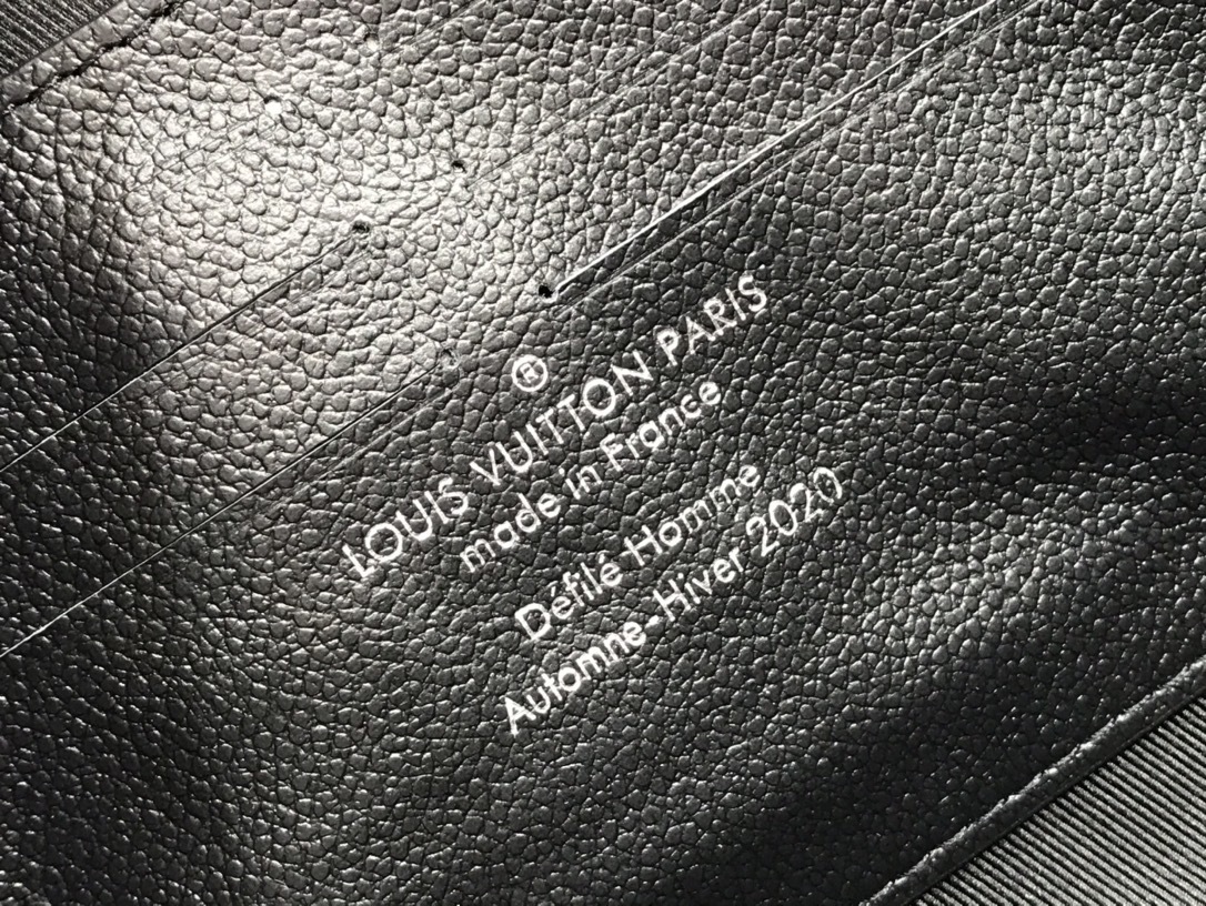 LV SOFT TRUNK wallet M45671